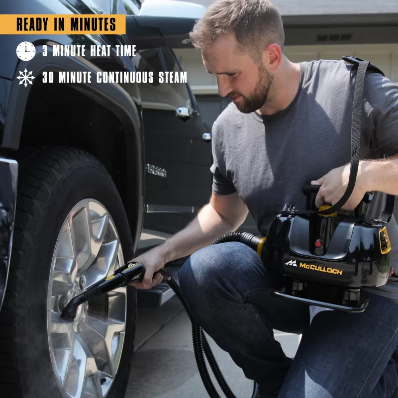 Lifestyle image of a MC1270 heavy duty Steam cleaner cleaning a truck tire. There is white text and supporting white icons that says: 3 minute heat time, 30 minute continuous steam
